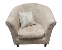 A contemporary tub chair in two-tone fabric