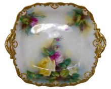 A Royal Worcester gilded twin handled dish decorated with roses.