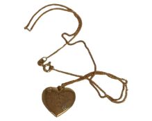 A 9ct yellow gold necklace with 9ct yellow gold heart shaped pendant