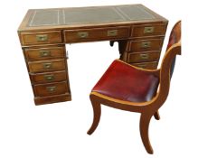A reproduction yew wood military style pedestal desk together with Burgundy leather covered chair.