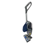 A Vax upright carpet cleaner.
