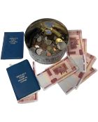 A tin containing coins, Russian banknotes etc. together with a brass lighter.