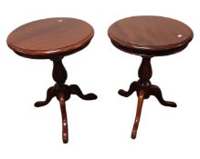 A pair of reproduction mahogany occasional tables