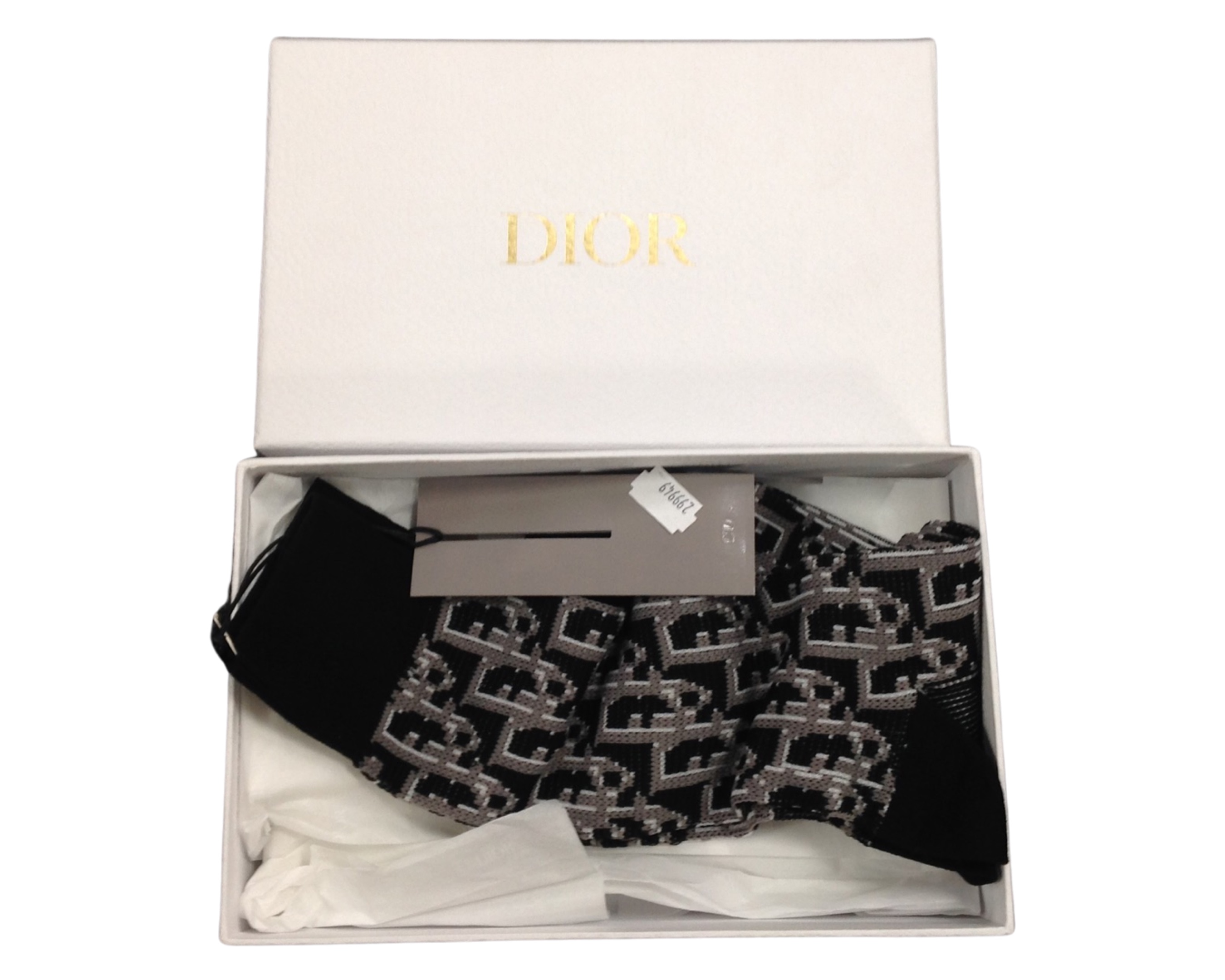 A pair of Christian Dior socks with box, packaging and tag.