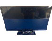 A JMB 24" LCD TV with remote control.