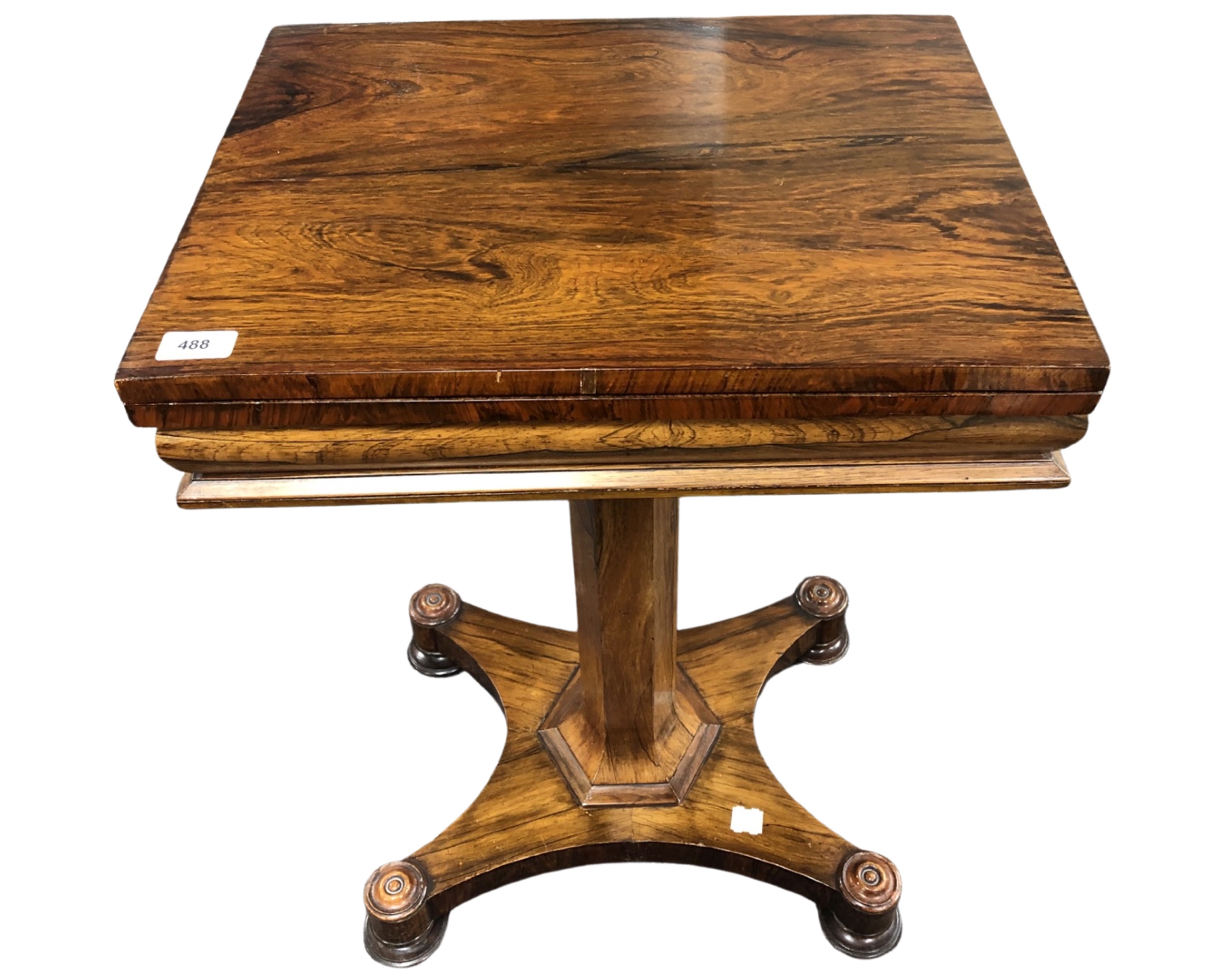 A William IV rosewood turnover top card table on quatrofoil base.