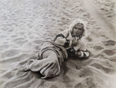 After photographer George Barris photo of Marilyn Monroe on Santa Monica beach on July 13th 1962.