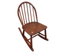 An antique elm child's rocking chair