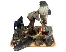 A tray of modern ornaments including horse figures and an eagle on plinth.