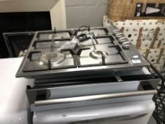 A gas cooker hob together with an AEG warming drawer