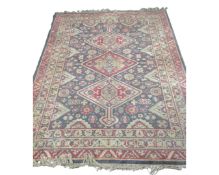 A Caucasian design rug, 230cm by 168cm.