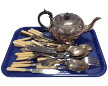 A tray containing a silver plated teapot and cutlery.