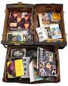 Three boxes containing a quantity of Beatles memorabilia and further music memorabilia and books
