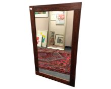 A 20th century rosewood framed mirror, 73cm by 118cm.