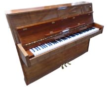An Osztreicher overstrung piano in gloss finish case, with key.