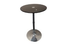 A black glass topped poser bar table.