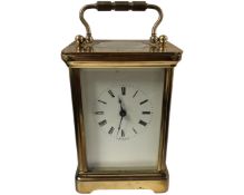 A 20th century brass carriage clock with key.