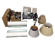 Two boxes containing lights, table lamps, adjustable lamps, shades, wall lights etc.
