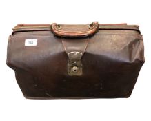 A brown leather doctor's bag.
