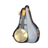 A Burwood acoustic guitar, model JC-36F, in soft carry case, together with a banjo ukulele,