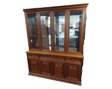 A reproduction four door glazed display cabinet
