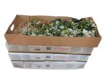 Four boxes of artificial flowers.