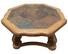 A contemporary oak octagonal coffee table with tiled top