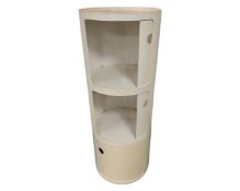 A plastic cylindrical storage cabinet.
