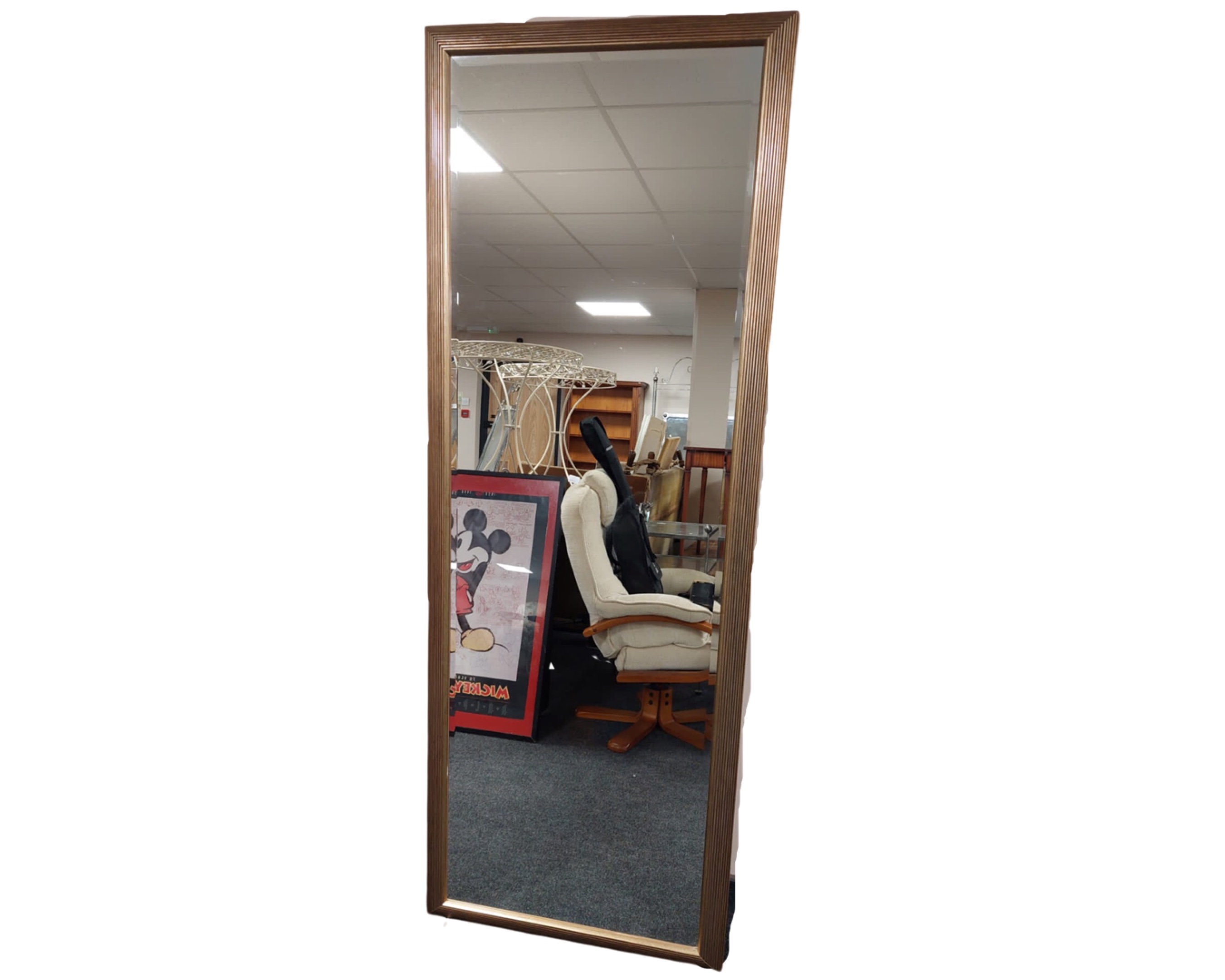 A rectangular bevelled mirror in golden frame