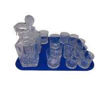 A tray of crystal whiskey tumblers and two decanters.