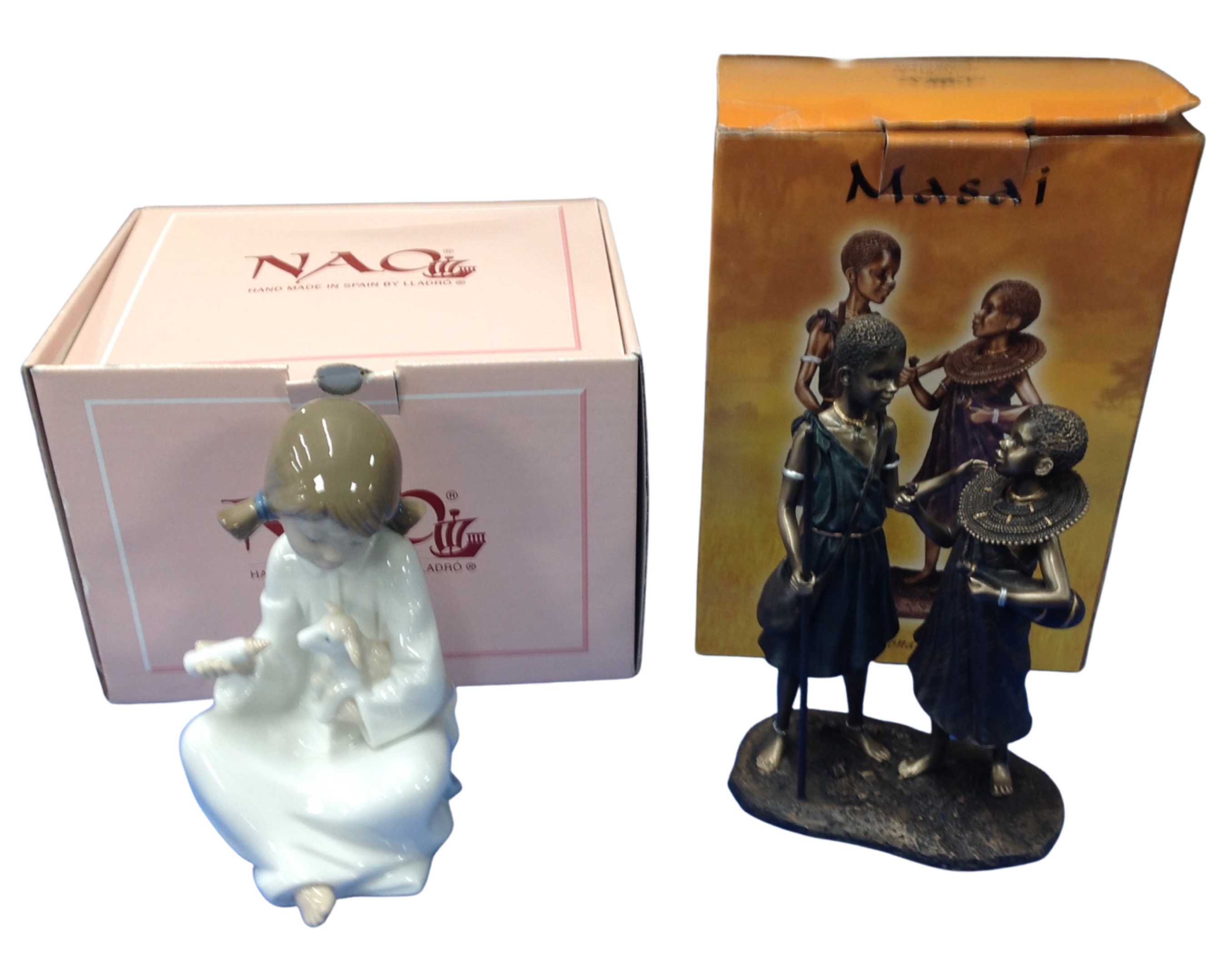 A Nao figure of a child feeding a lamb together with a Leonardo collection Masai figure.