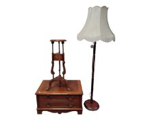 A reproduction mahogany plant stand together with a mahogany standard lamp and entertainment stand