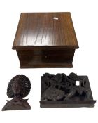 Two Eastern carvings together with a wooden storage box containing a bowl.