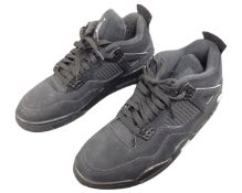 A pair of black Nike Air Jordan Flight sneakers.