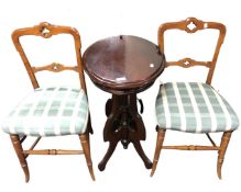 A mahogany oval table together with a pair of bedroom chairs