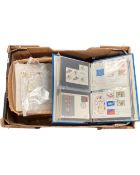 A box containing two albums of First Day Covers etc.