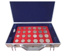 A case containing a large quantity of trays of coins, 20th century sixpence pieces,