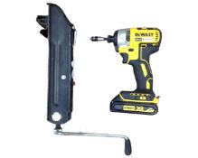 A DeWalt brushless electric screwdriver together with a car jack.