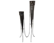 Two tall metal plant stands