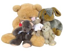 A collection of soft toys including a teddy bear and a rabbit.