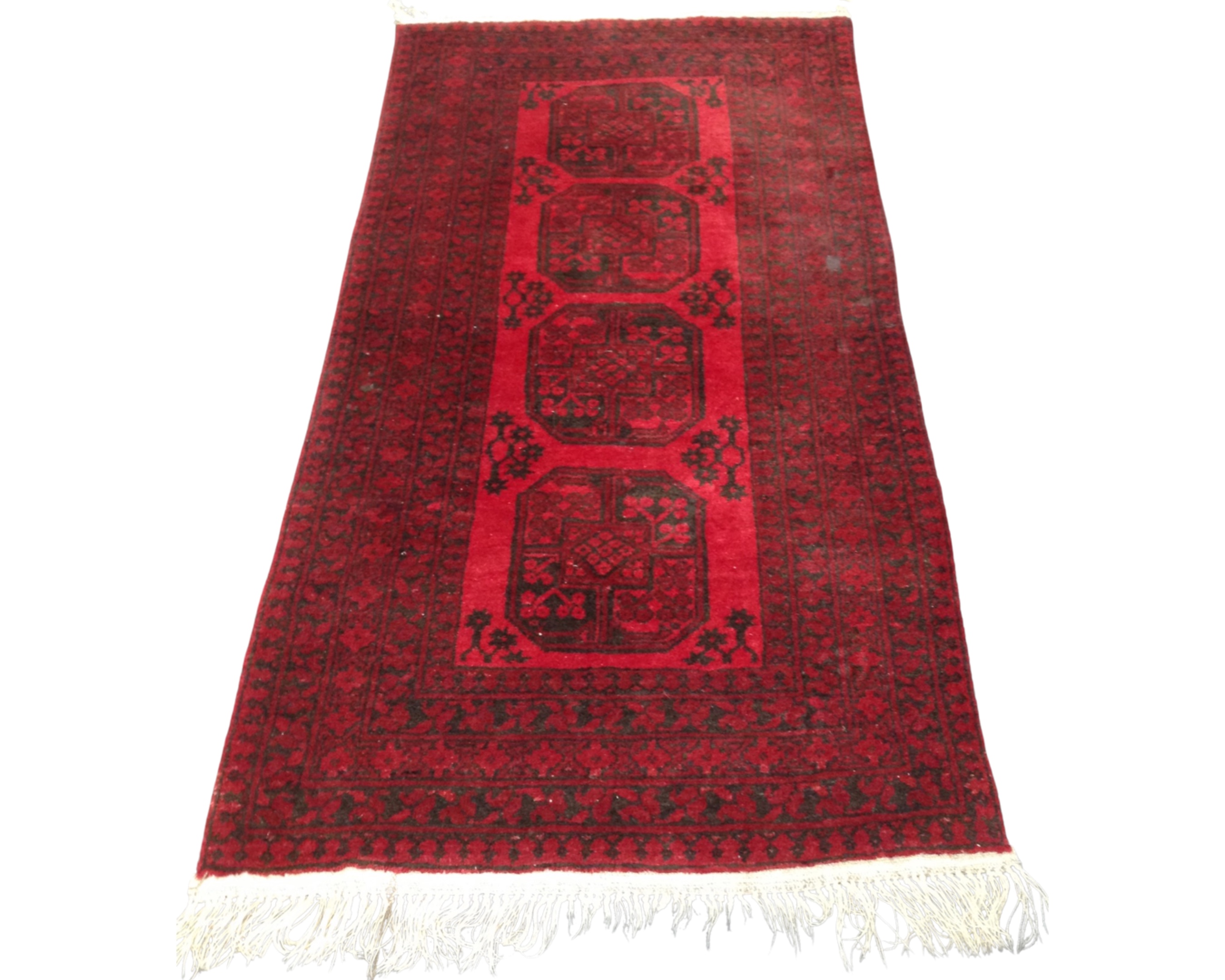 A Bokhara rug, Afghanistan, 101cm by 196cm.
