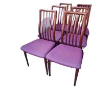 A set of six rail back dining chairs in mahogany finish.