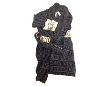 A Versace dressing gown, with tag.