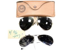 Two pairs of Ray-Ban Aviator sunglasses, silvered finish frame and gilt finish frame,