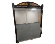 A 19th century mirror in an ebonized and hand pained frame. (width 118.5cm, height 157.