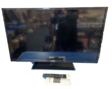 An E-Motion 40" LED TV with remote control.