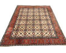 An Indian carpet with repeat lattice motif on cream ground, 201cm by 248cm.