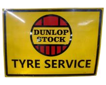 A garage sign on tin - Dunlop Stock Tyre Service.