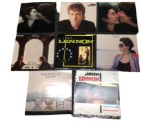 Six vinyl record cases containing LPs and singles including the Beatles.