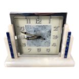 An Art Deco chrome-cased mantel clock, on alabaster and lapis lazuli stand, overall height 12 cm.